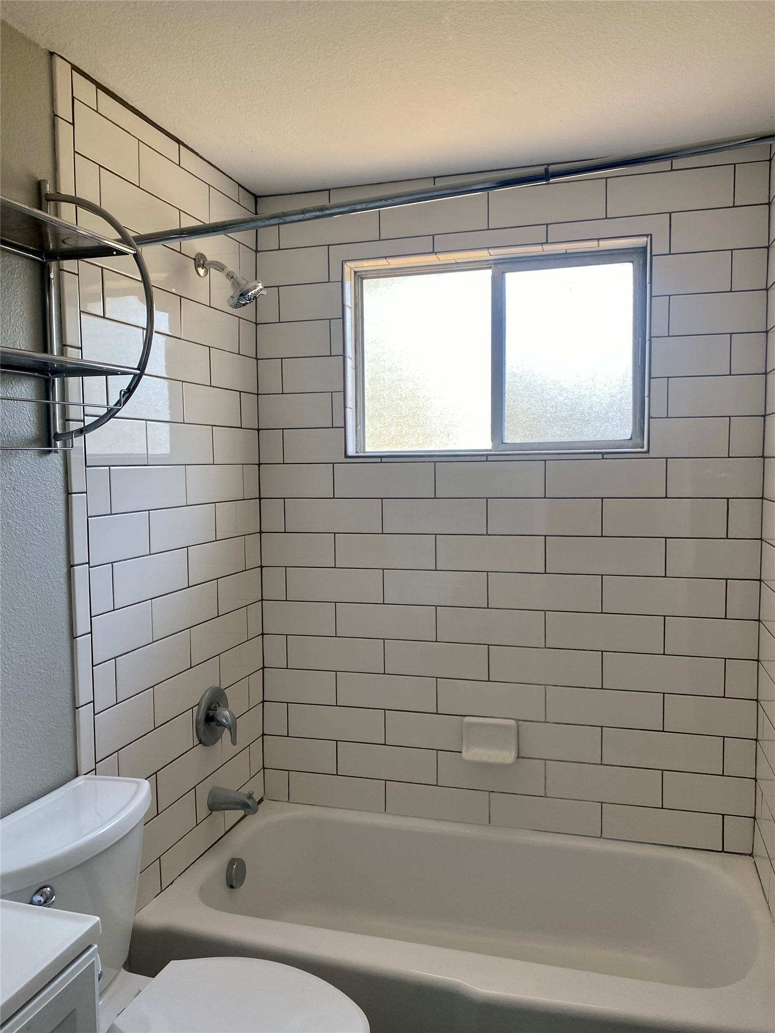400 Swanee Drive, Unit A Austin, TX 78752 - Photo 5 of 8 a bathroom with a bathtub and shower