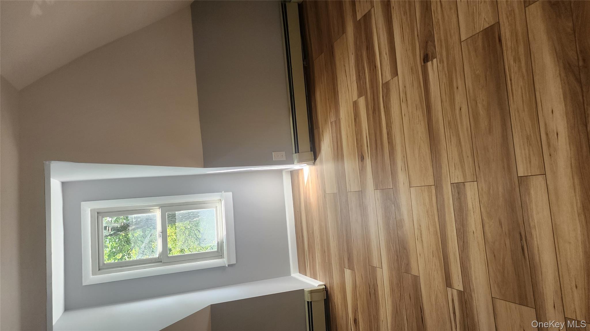 38 Moulton Avenue, Unit 2 Dobbs Ferry, NY 10522 - Photo 12 of 27 a view of empty room with window and wooden floor