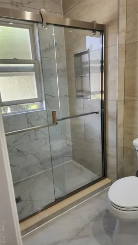 a bathroom with a mirror and a sink