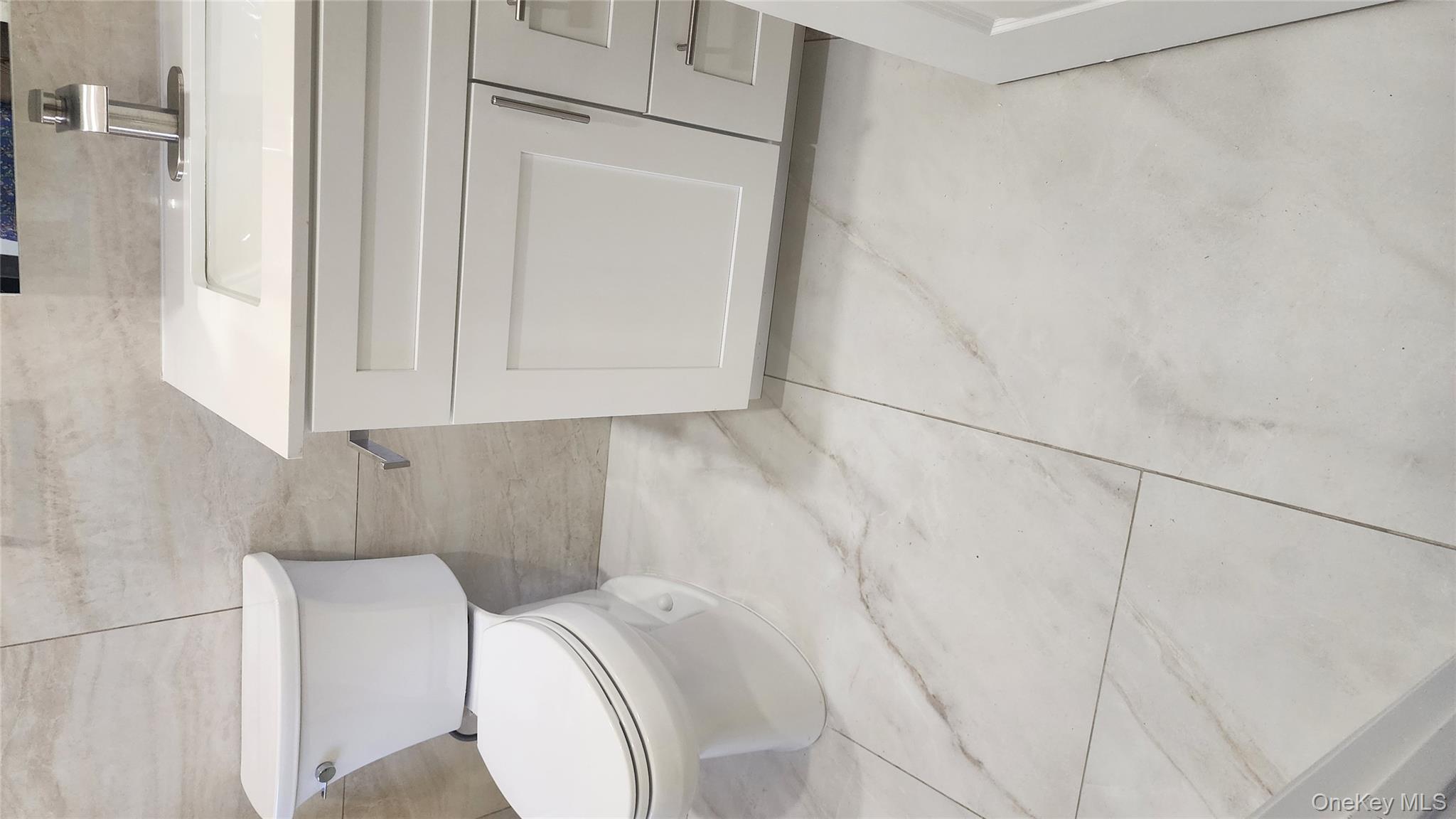 38 Moulton Avenue, Unit 2 Dobbs Ferry, NY 10522 - Photo 16 of 27 a bathroom with a toilet and a sink