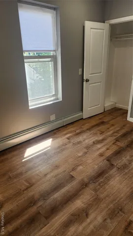 a view of a yard with large trees