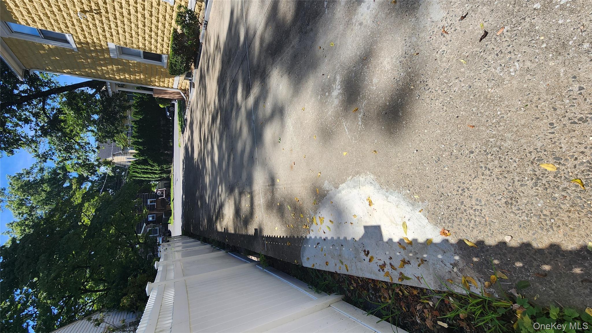 38 Moulton Avenue, Unit 2 Dobbs Ferry, NY 10522 - Photo 23 of 27 a view of a yard with large trees