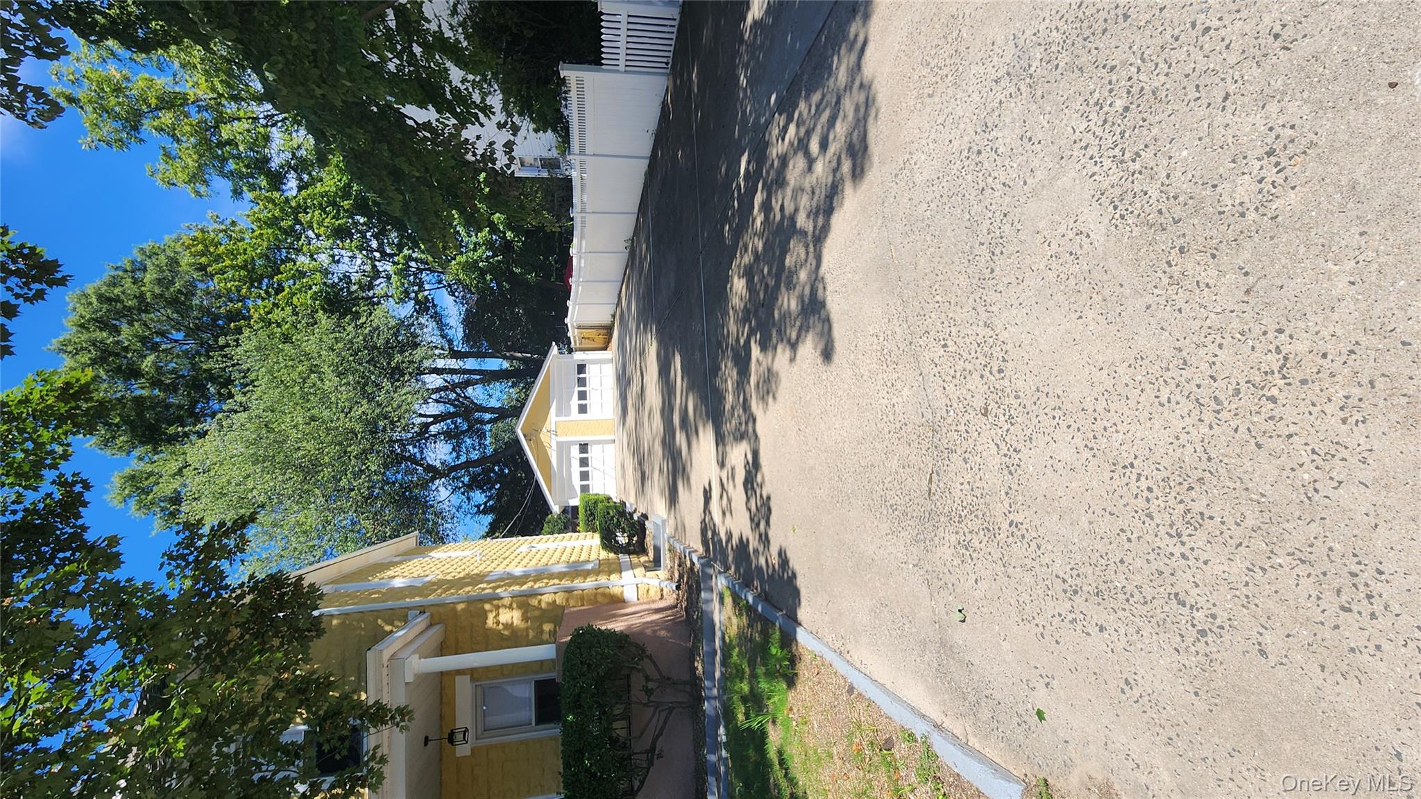 38 Moulton Avenue, Unit 2 Dobbs Ferry, NY 10522 - Photo 26 of 27 a view of a house with a yard and large tree