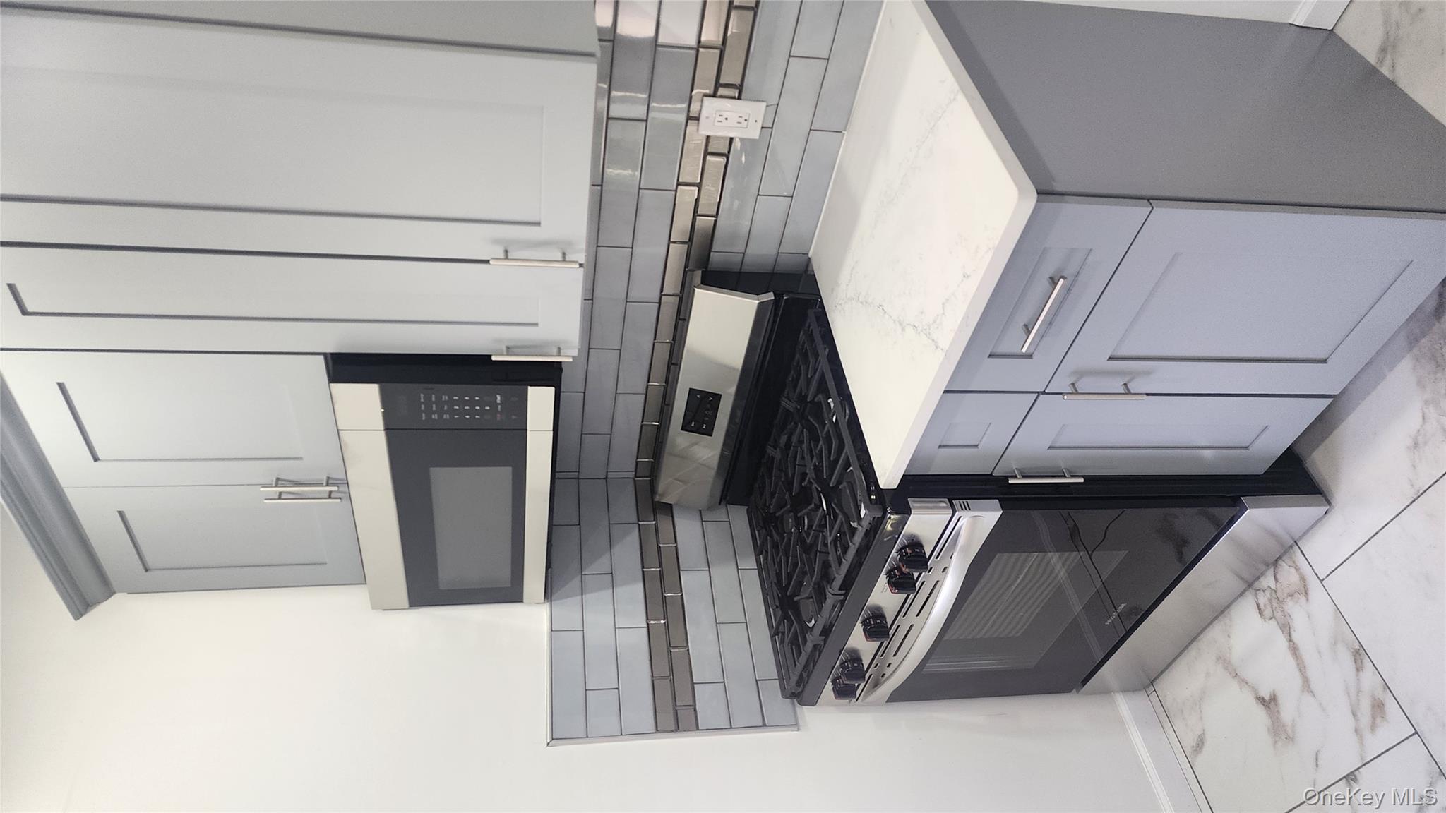 38 Moulton Avenue, Unit 2 Dobbs Ferry, NY 10522 - Photo 3 of 27 a stove top oven sitting inside of a kitchen