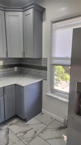 a view of kitchen with a sink and a window