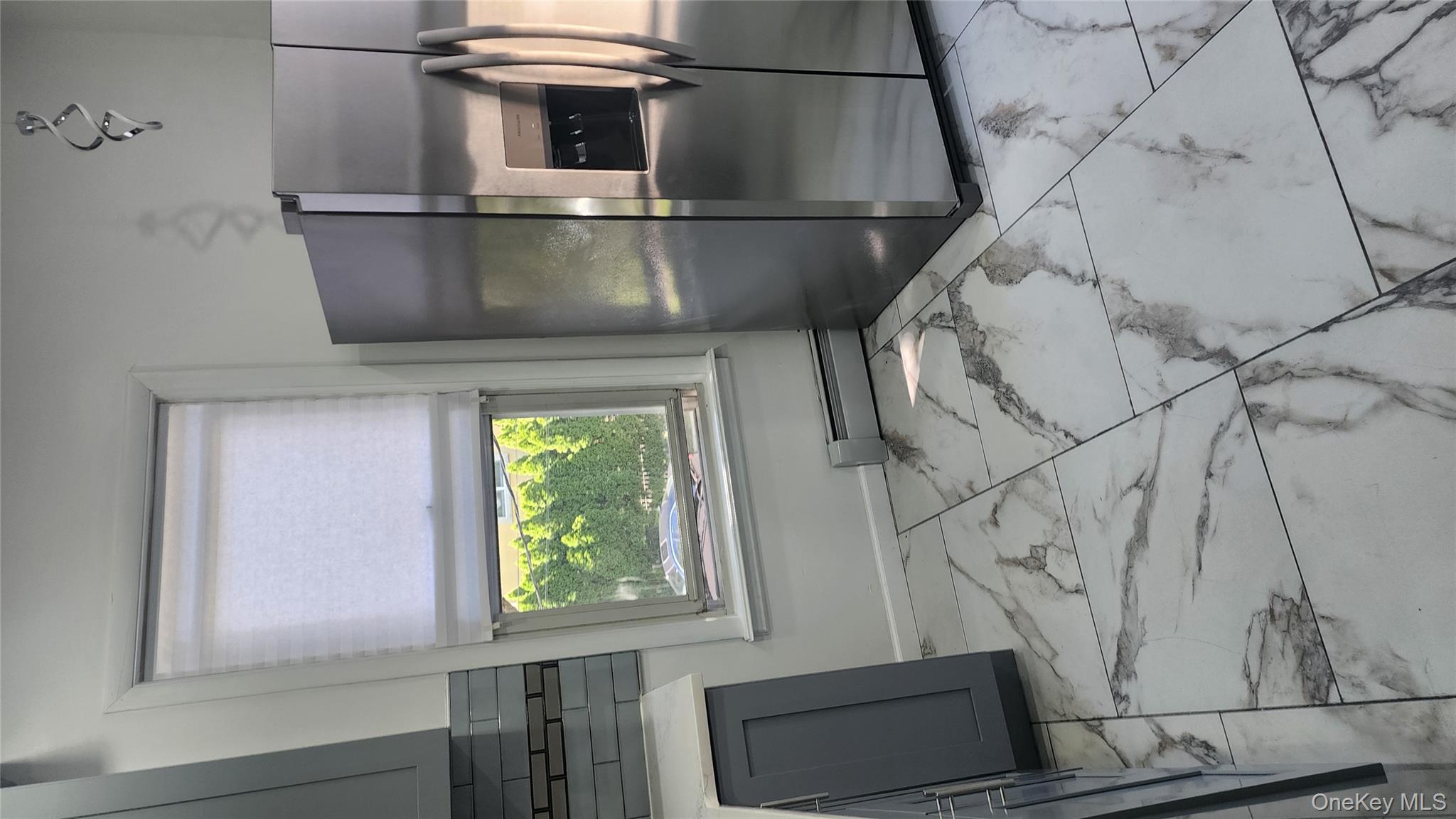 38 Moulton Avenue, Unit 2 Dobbs Ferry, NY 10522 - Photo 5 of 27 a kitchen with a refrigerator and a stove