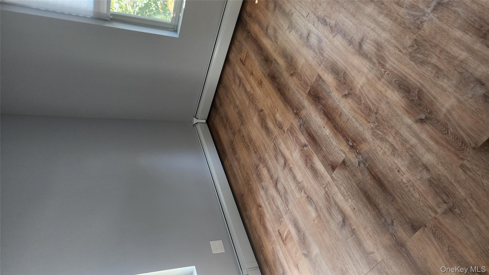 38 Moulton Avenue, Unit 2 Dobbs Ferry, NY 10522 - Photo 7 of 27 a view of empty room with wooden floor and fan