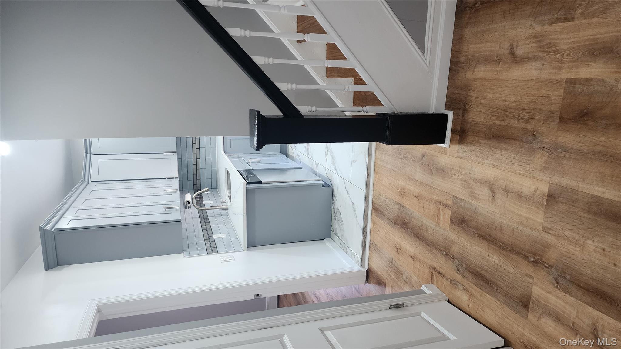38 Moulton Avenue, Unit 2 Dobbs Ferry, NY 10522 - Photo 9 of 27 a view of a kitchen with wooden floor and a sink