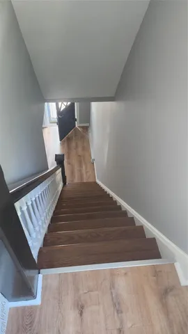 a view of staircase with white walls