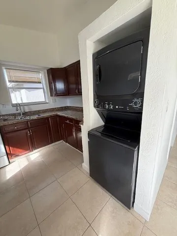 a kitchen with a stove and a microwave