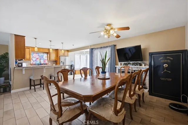 a view of a dining room with furniture and a livingroom