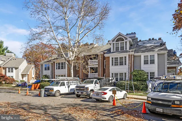 a car parked in front of a houses