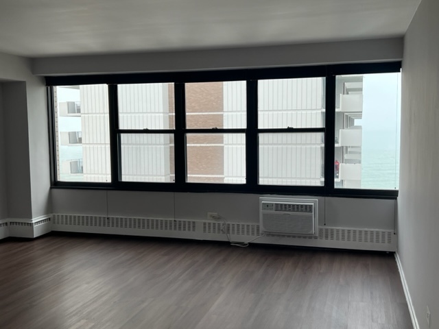 6030 North Sheridan Road, Unit 1712 Chicago, IL 60660 - Photo 15 of 28 a living room with a large window