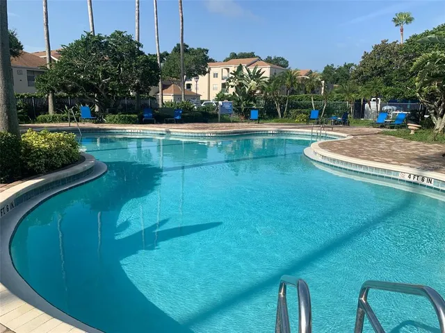a view of a swimming pool with a patio