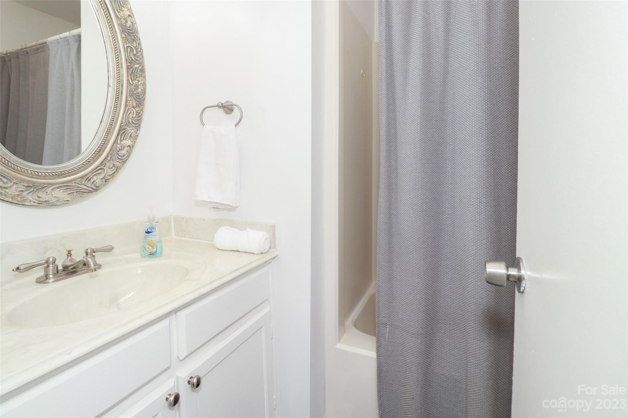 4721 Morehead Road, Unit 204 Concord, NC 28027 - Photo 15 of 19 a bathroom with a sink and a mirror