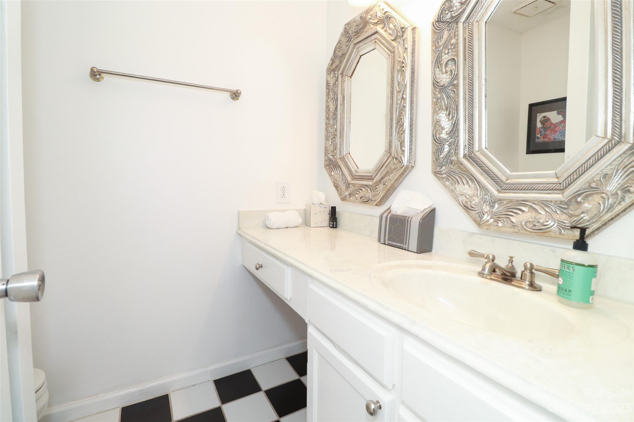 4721 Morehead Road, Unit 204 Concord, NC 28027 - Photo 17 of 19 a bathroom with a sink and a mirror