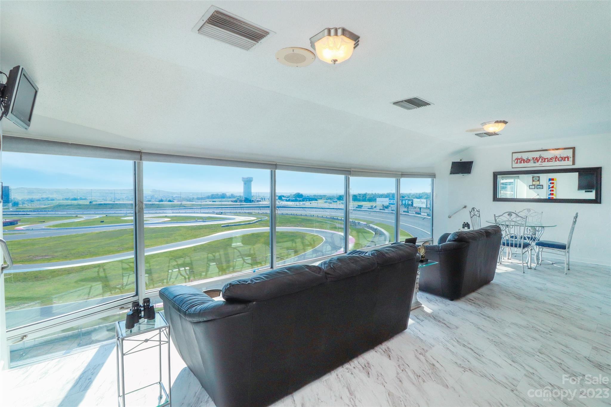 4721 Morehead Road, Unit 204 Concord, NC 28027 - Photo 5 of 19 a living room with furniture and floor to ceiling windows