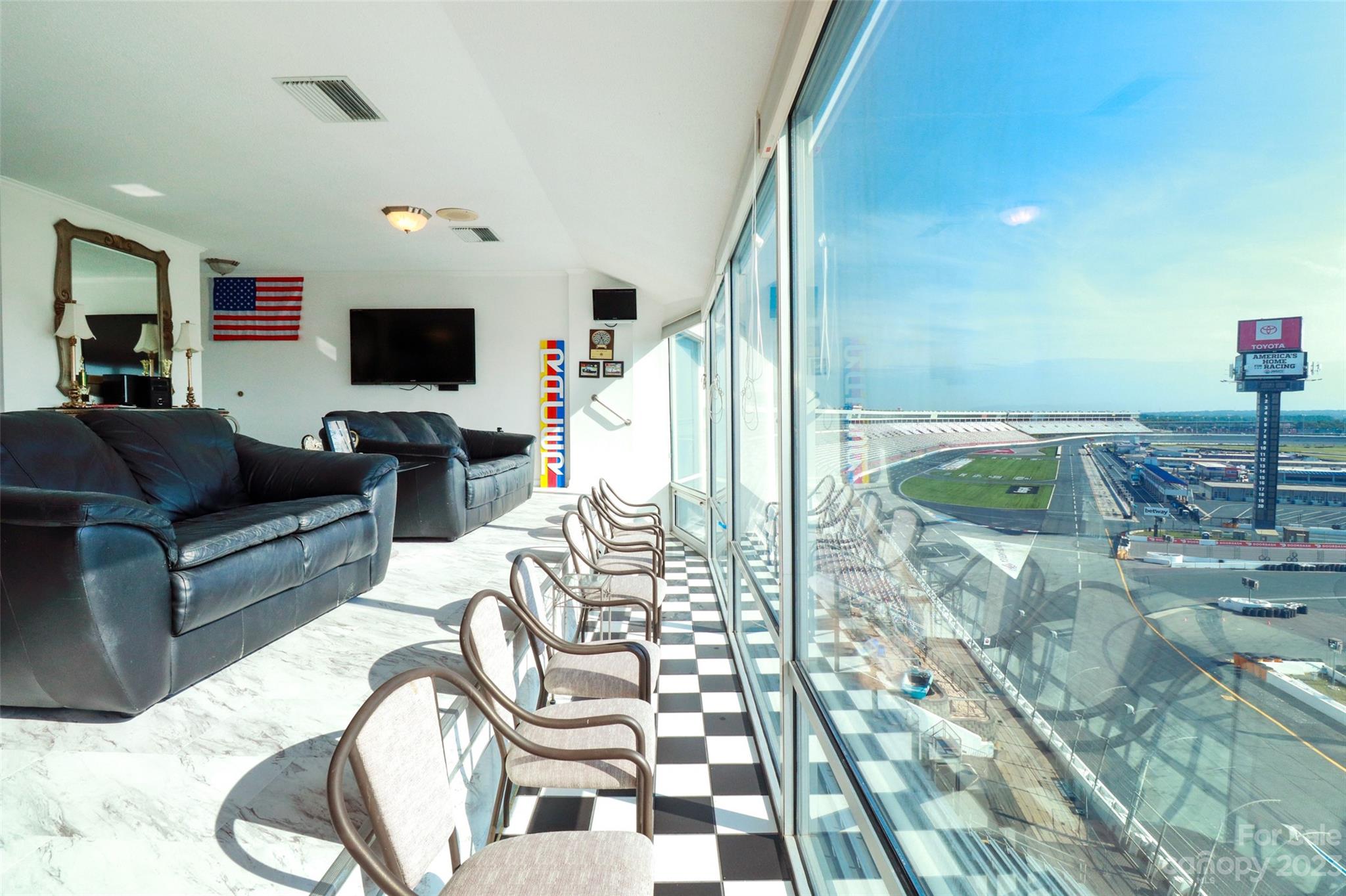 4721 Morehead Road, Unit 204 Concord, NC 28027 - Photo 7 of 19 a living room with furniture and a flat screen tv