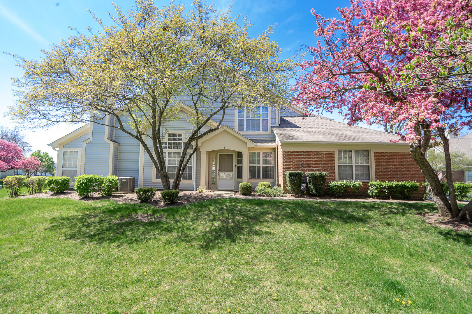 a view of a house with a yard
