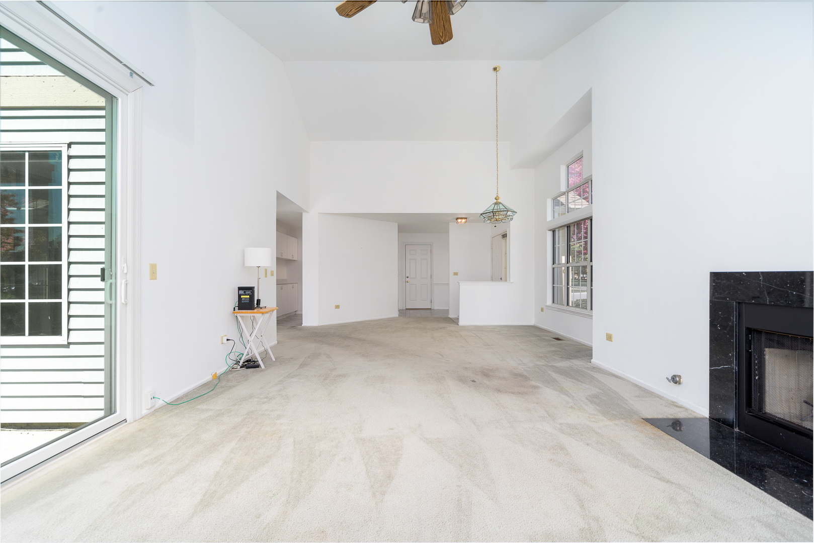 446 Cromwell Circle, Unit 1 Bartlett, IL 60103 - Photo 13 of 28 a view of empty room with a fireplace and window