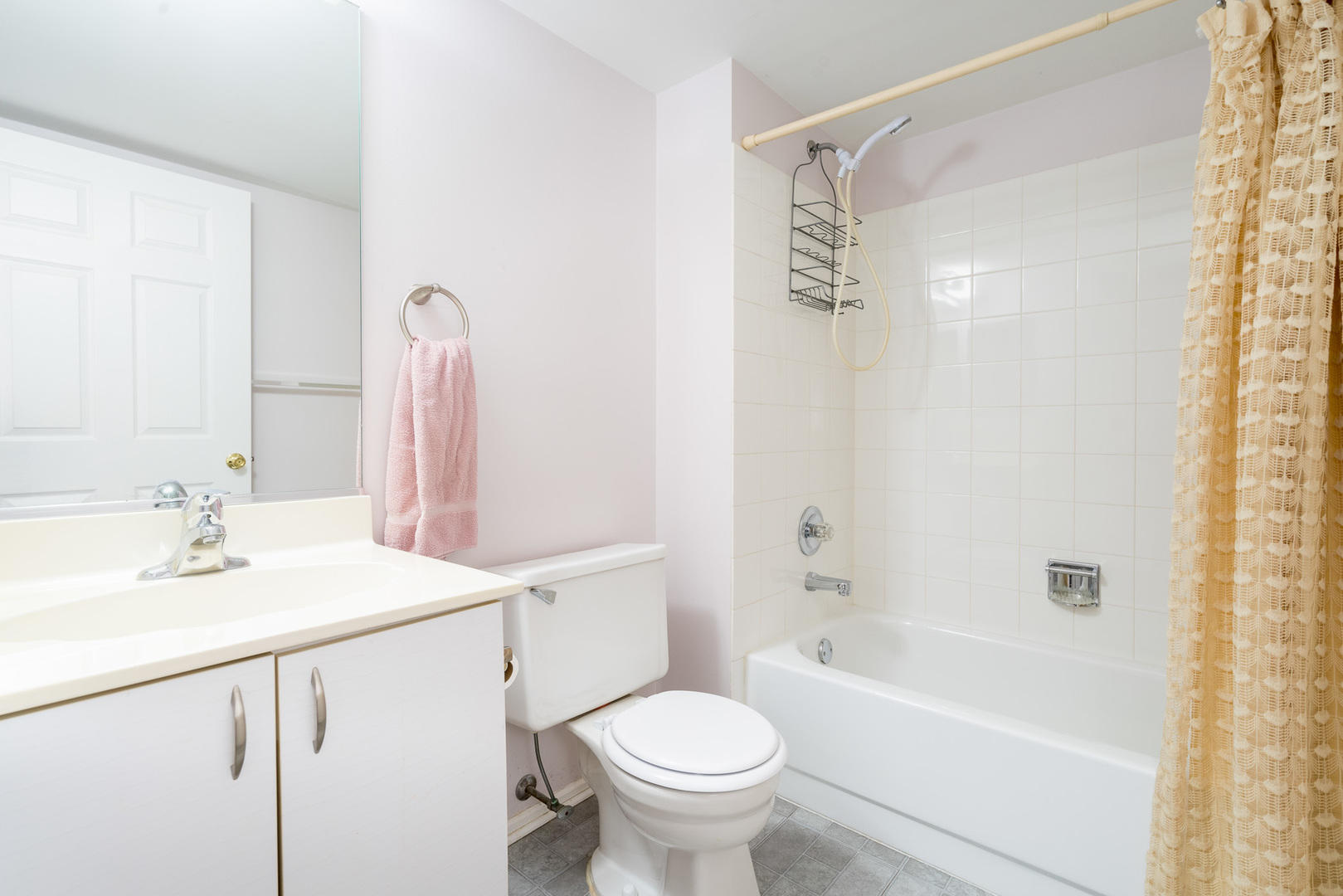 446 Cromwell Circle, Unit 1 Bartlett, IL 60103 - Photo 18 of 28 a bathroom with a sink toilet and shower