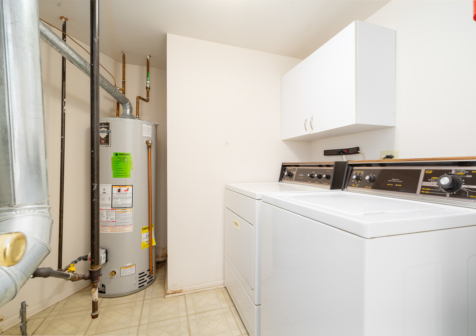 446 Cromwell Circle, Unit 1 Bartlett, IL 60103 - Photo 20 of 28 a utility room with dryer and washer