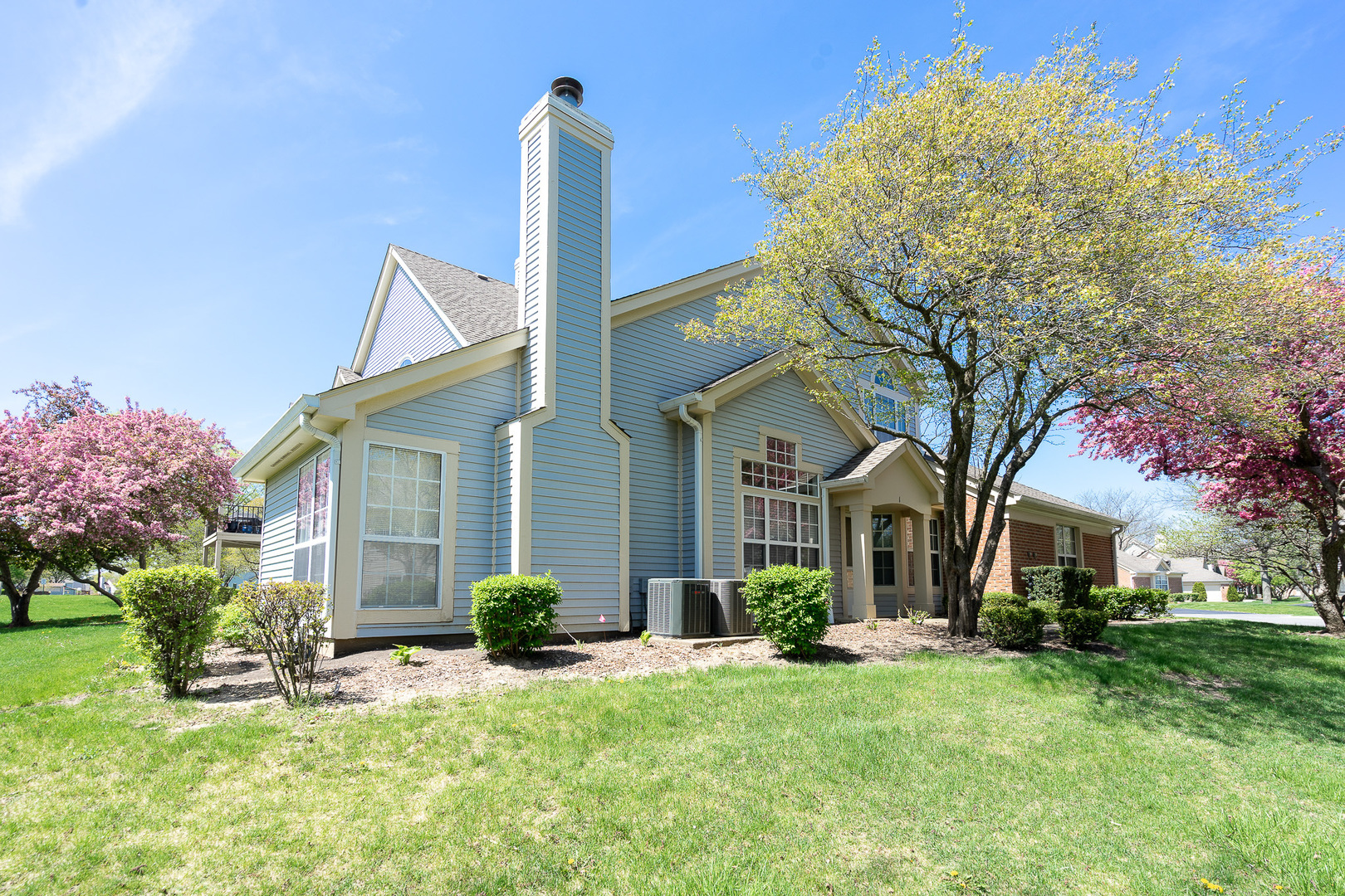 446 Cromwell Circle, Unit 1 Bartlett, IL 60103 - Photo 25 of 28 a front view of a house with garden