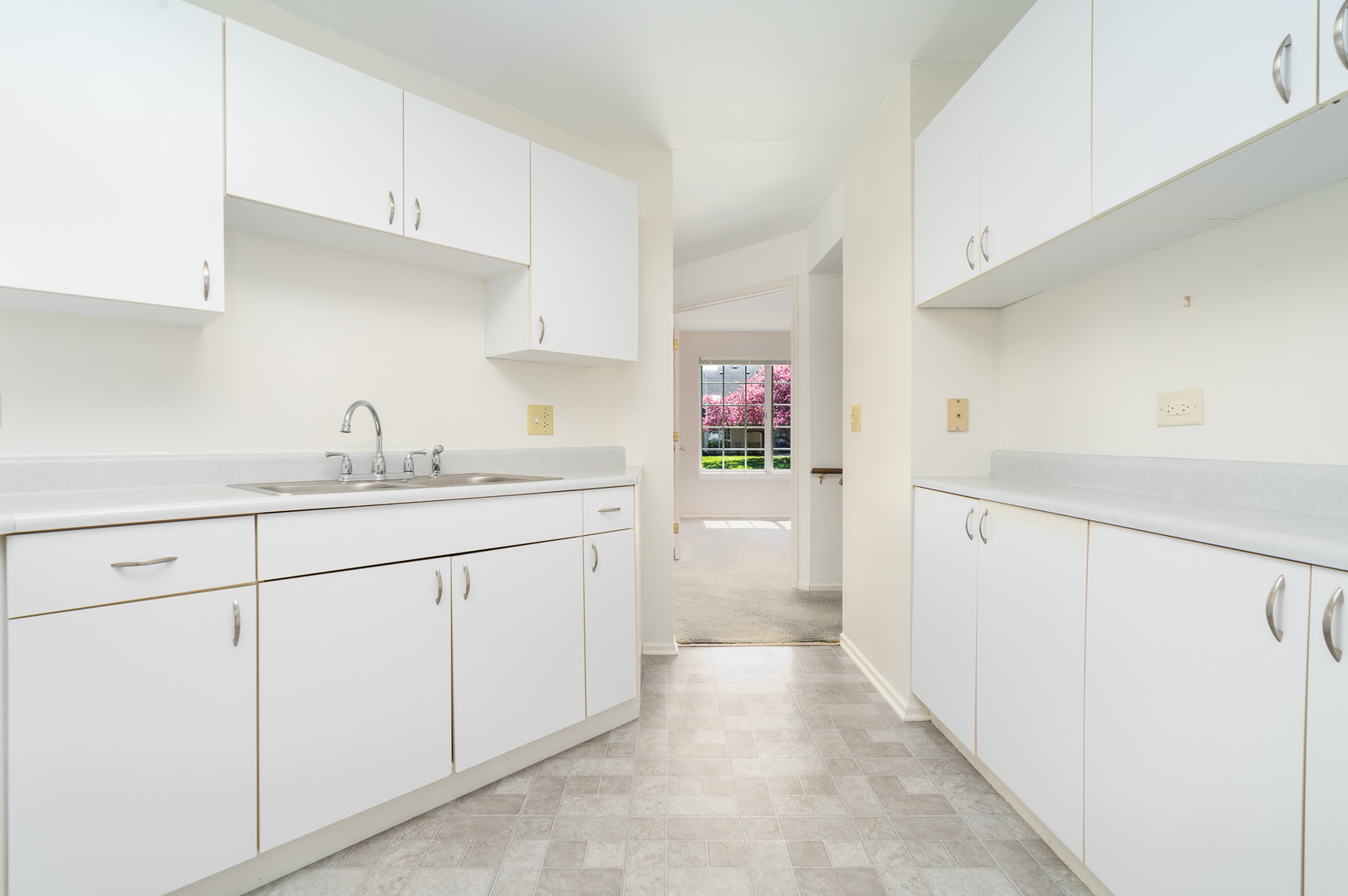 446 Cromwell Circle, Unit 1 Bartlett, IL 60103 - Photo 9 of 28 a kitchen with granite countertop white cabinets and white appliances
