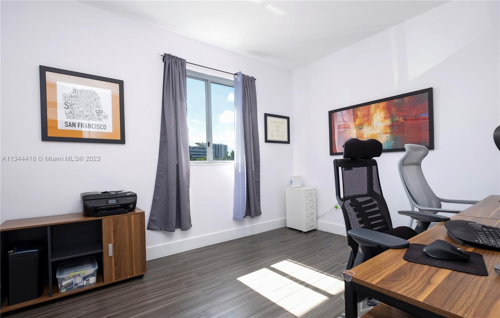 2734 Southwest 26th Street, Unit 2734 Miami, FL 33133 - Photo 20 of 41 a view of a workspace with furniture and a window