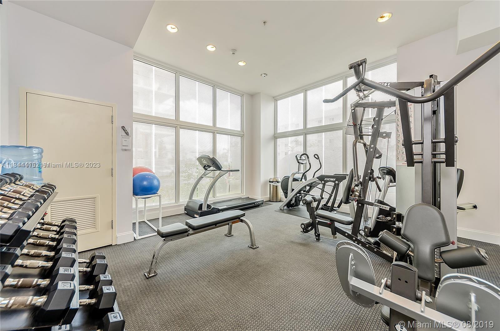 2734 Southwest 26th Street, Unit 2734 Miami, FL 33133 - Photo 29 of 41 a view of a room with gym equipment