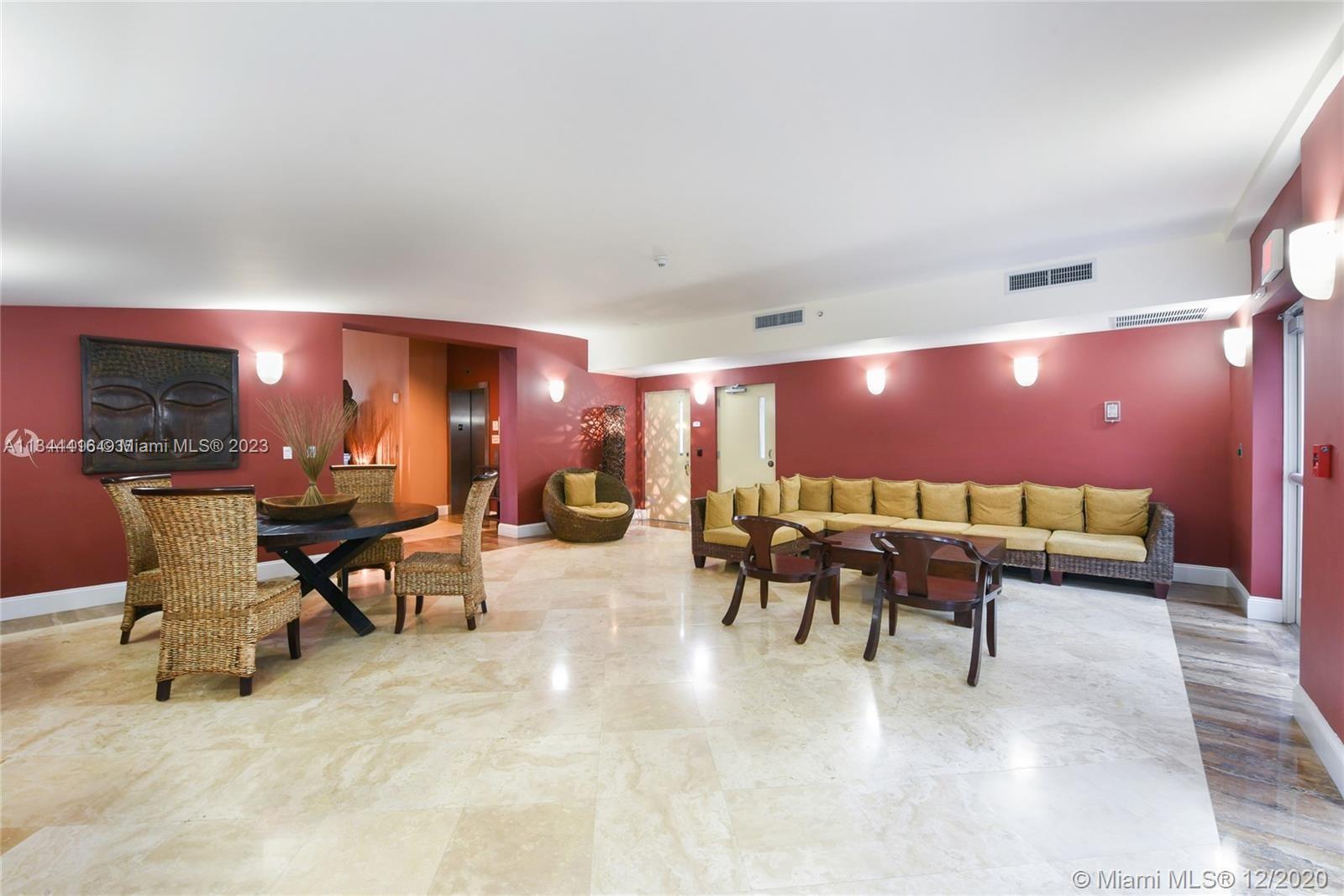 2734 Southwest 26th Street, Unit 2734 Miami, FL 33133 - Photo 31 of 41 a lobby with furniture and a lamp