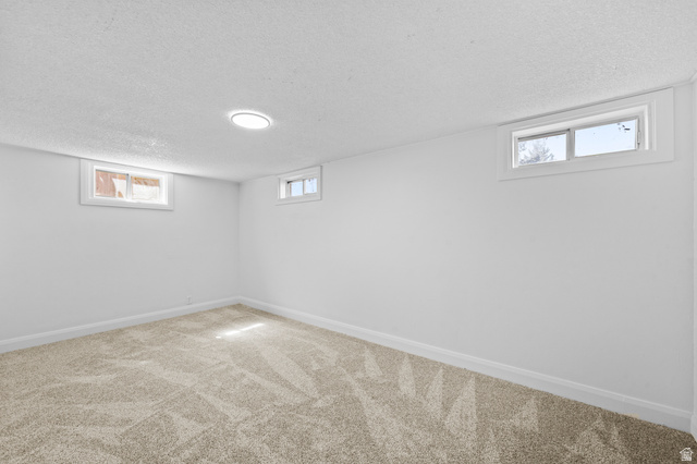 2267 West 4350th Street South Roy, UT 84067 - Photo 24 of 32 Below grade area with carpet floors and a textured ceiling