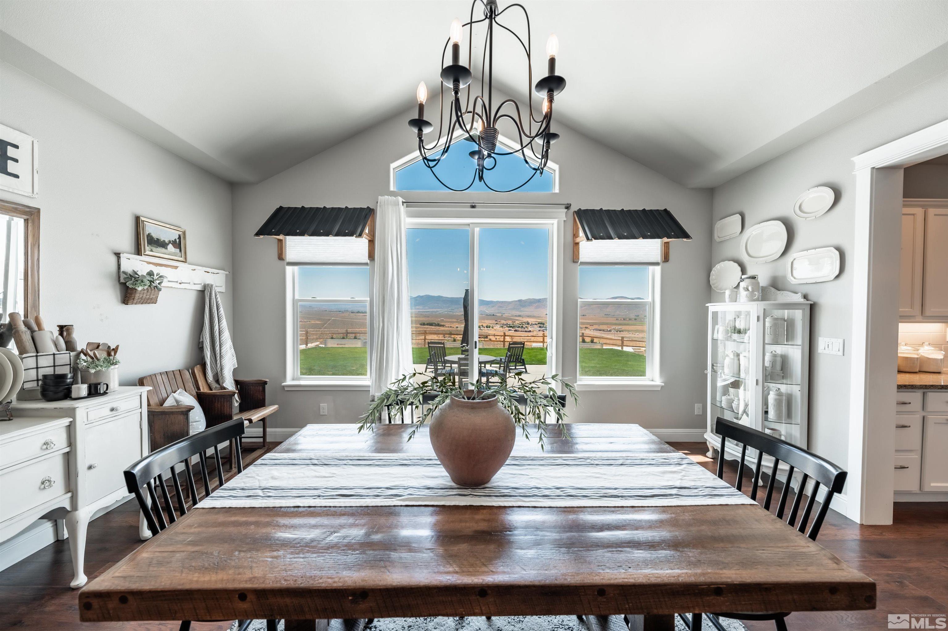 205 Bootstrap Lane Reno, NV 89510 - Photo 14 of 39 a view of a dining room with furniture wooden floor and chandelier
