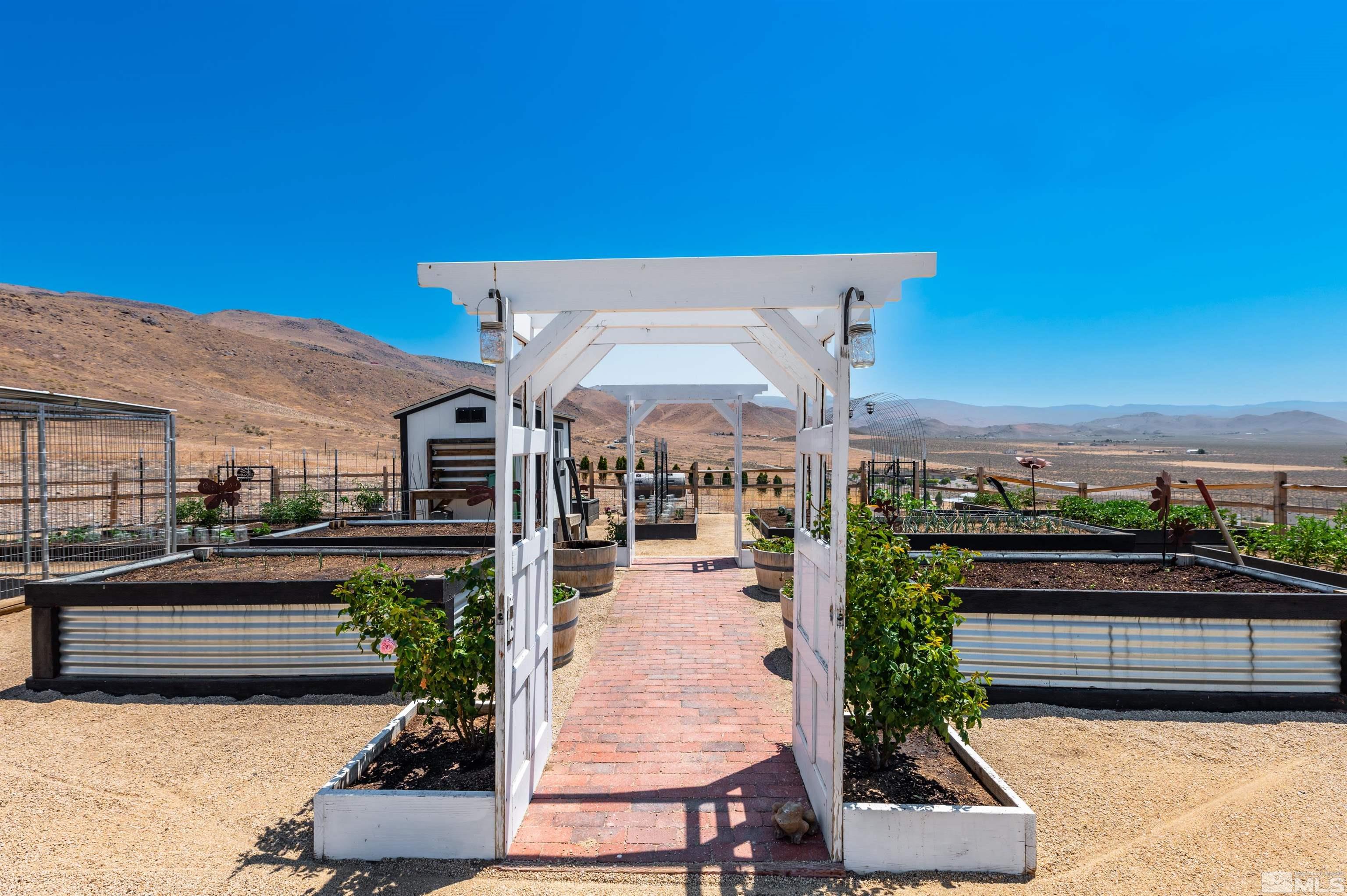205 Bootstrap Lane Reno, NV 89510 - Photo 21 of 39 a front view of a house with a garden