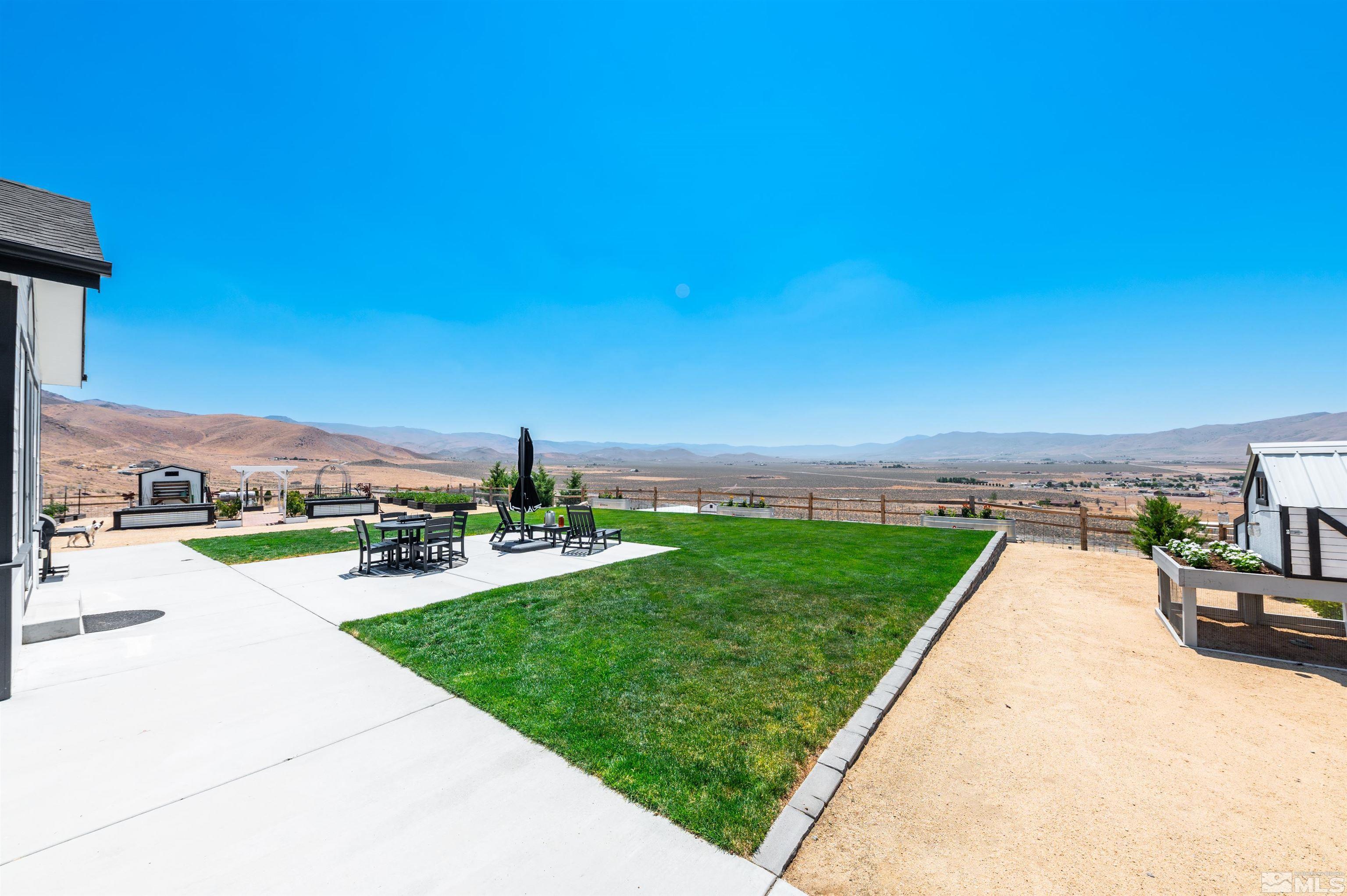 205 Bootstrap Lane Reno, NV 89510 - Photo 23 of 39 a view of a patio with a garden