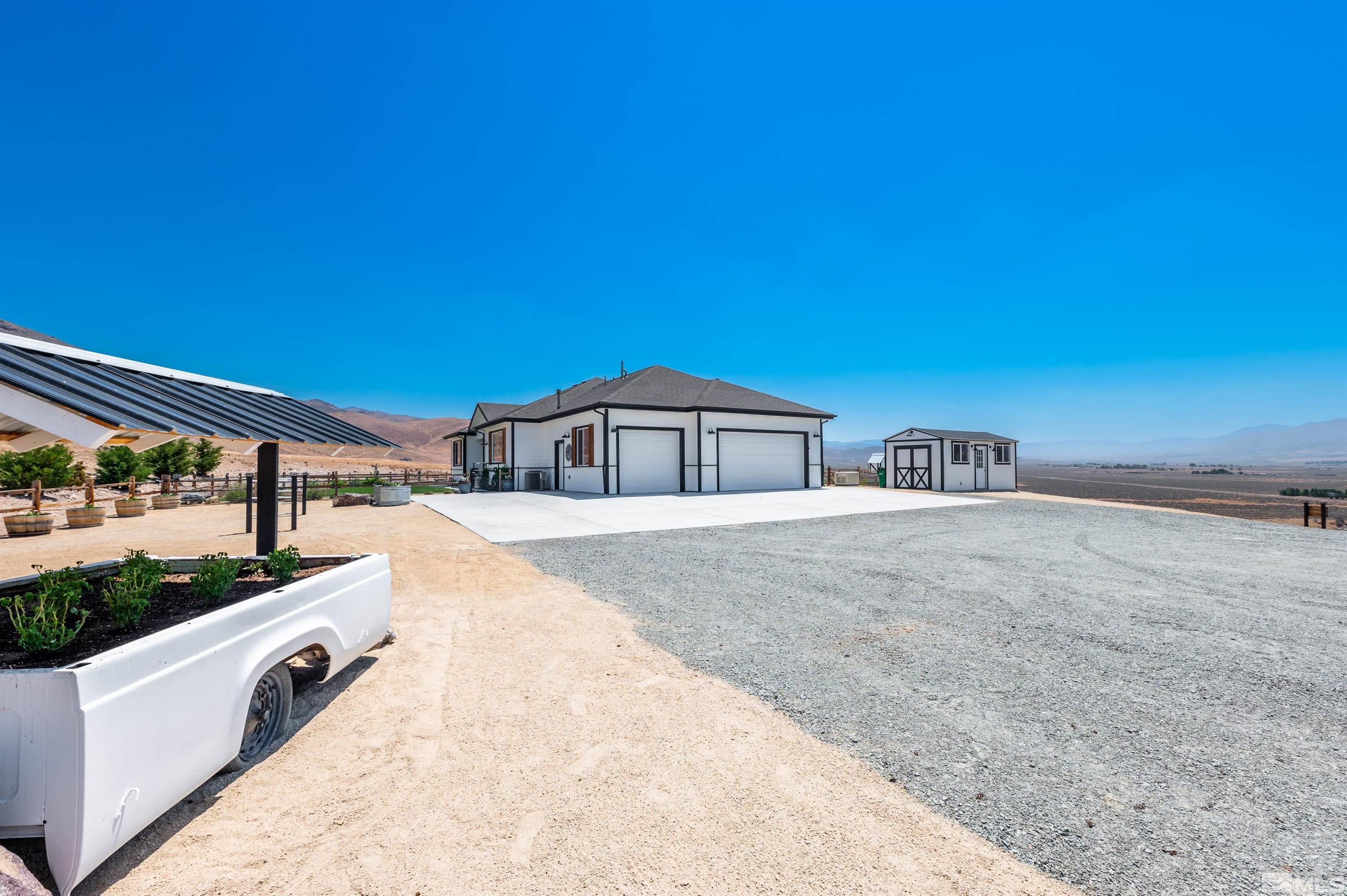 205 Bootstrap Lane Reno, NV 89510 - Photo 3 of 39 a spacious white building with a outdoor space
