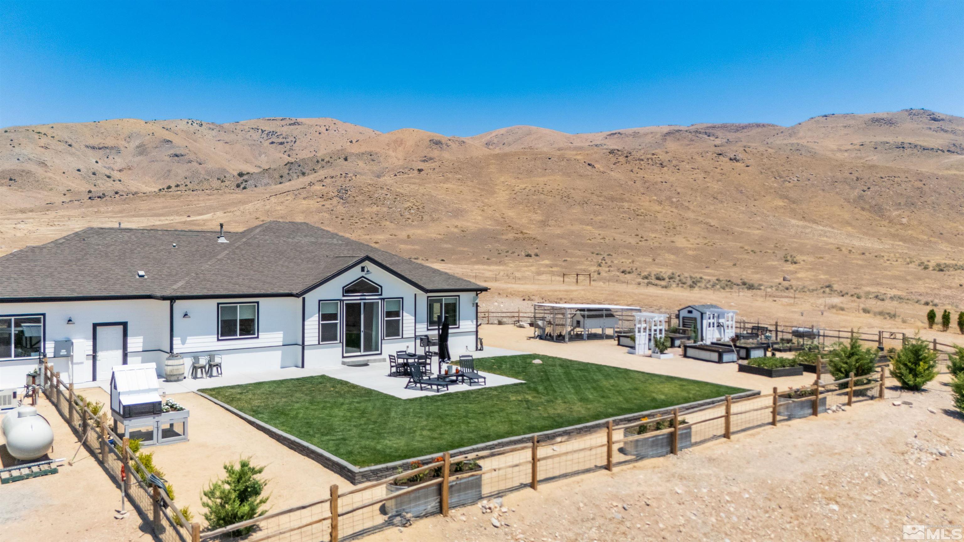 205 Bootstrap Lane Reno, NV 89510 - Photo 35 of 39 a front view of a house with a yard table and chairs