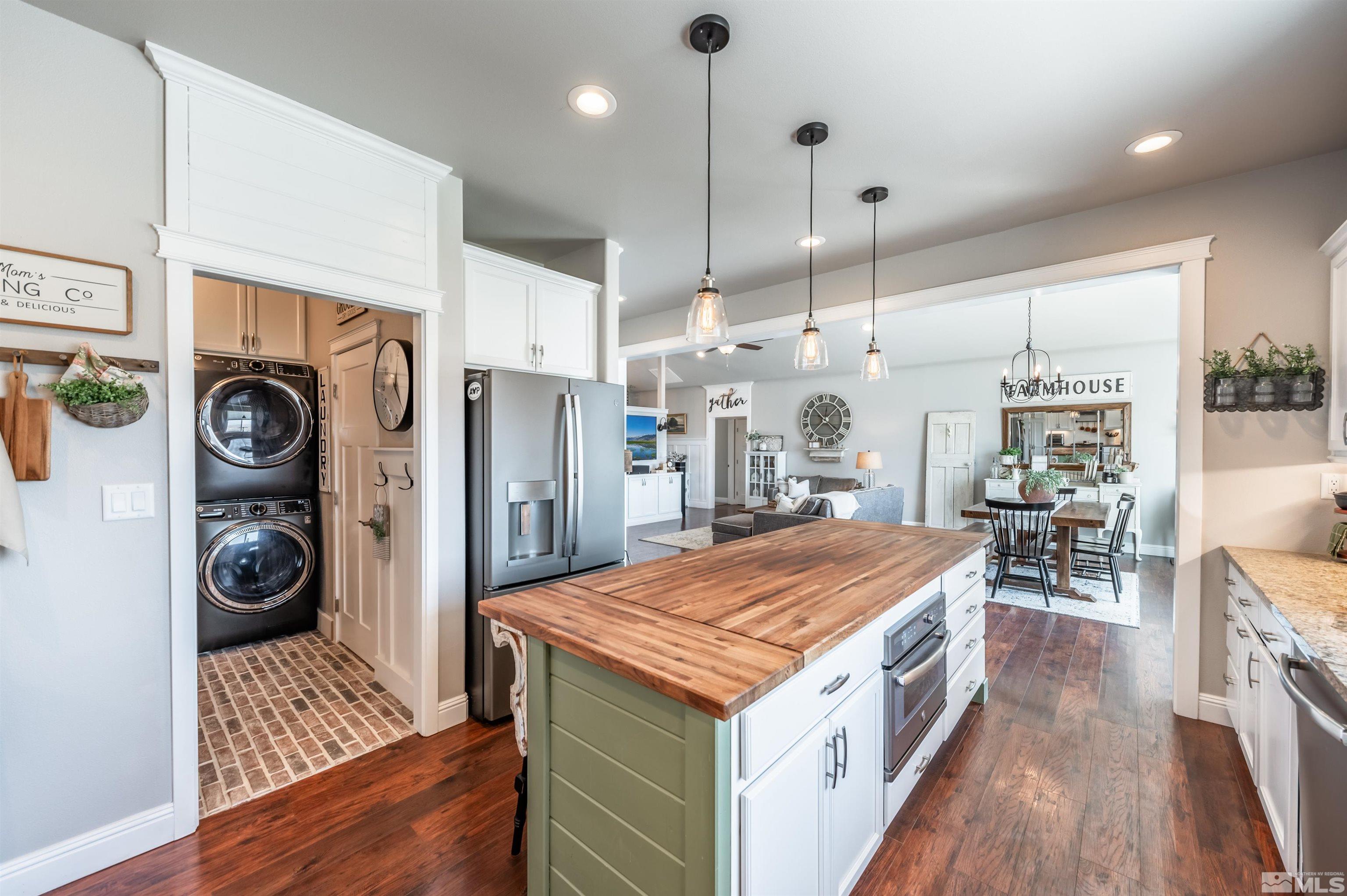 205 Bootstrap Lane Reno, NV 89510 - Photo 10 of 39 a kitchen with a stove a refrigerator and a wooden floor