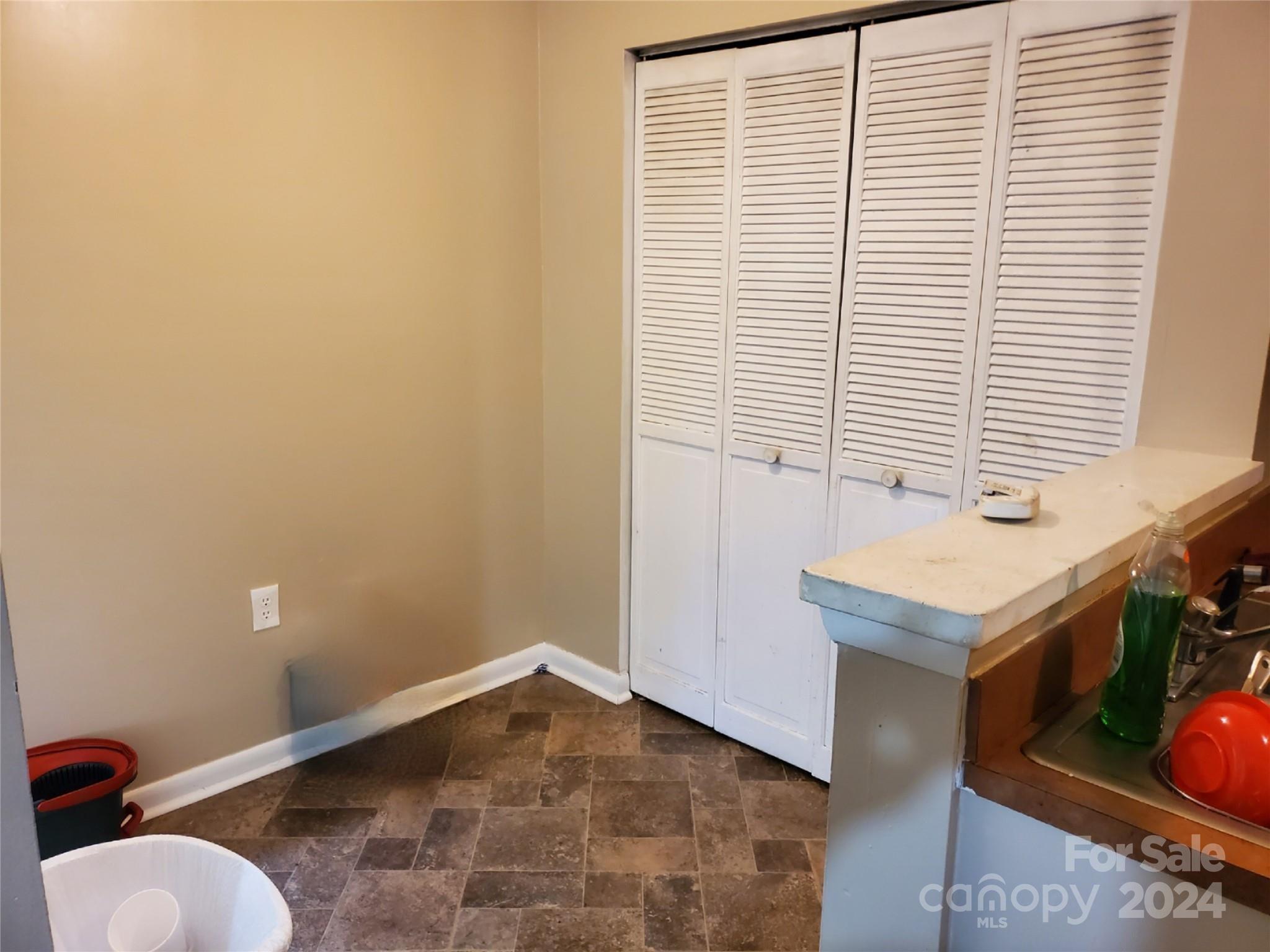 4804 Spring Lake Drive, Unit B Charlotte, NC 28212 - Photo 11 of 12 a bathroom with a sink and a toilet