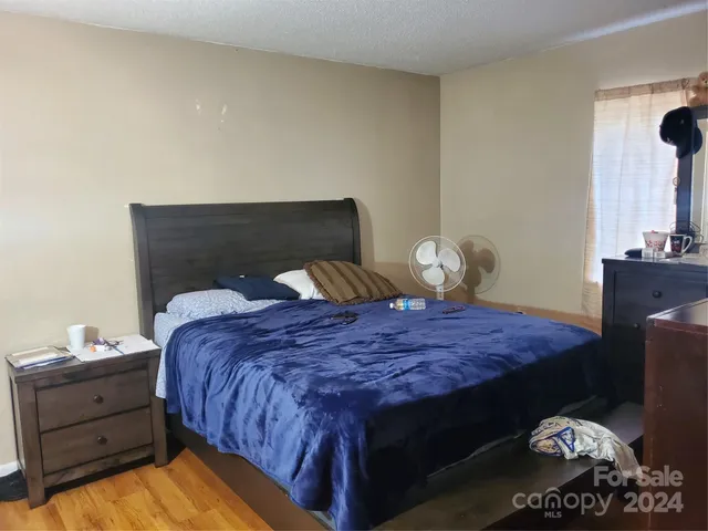 a bedroom with a bed and cabinets