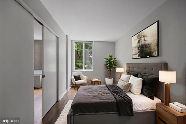 a bedroom with bed and a window