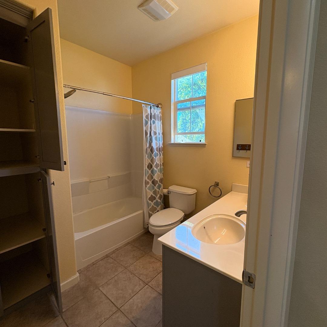7969 Kipling Circle Gilroy, CA 95020 - Photo 16 of 19 a bathroom with a sink toilet and shower
