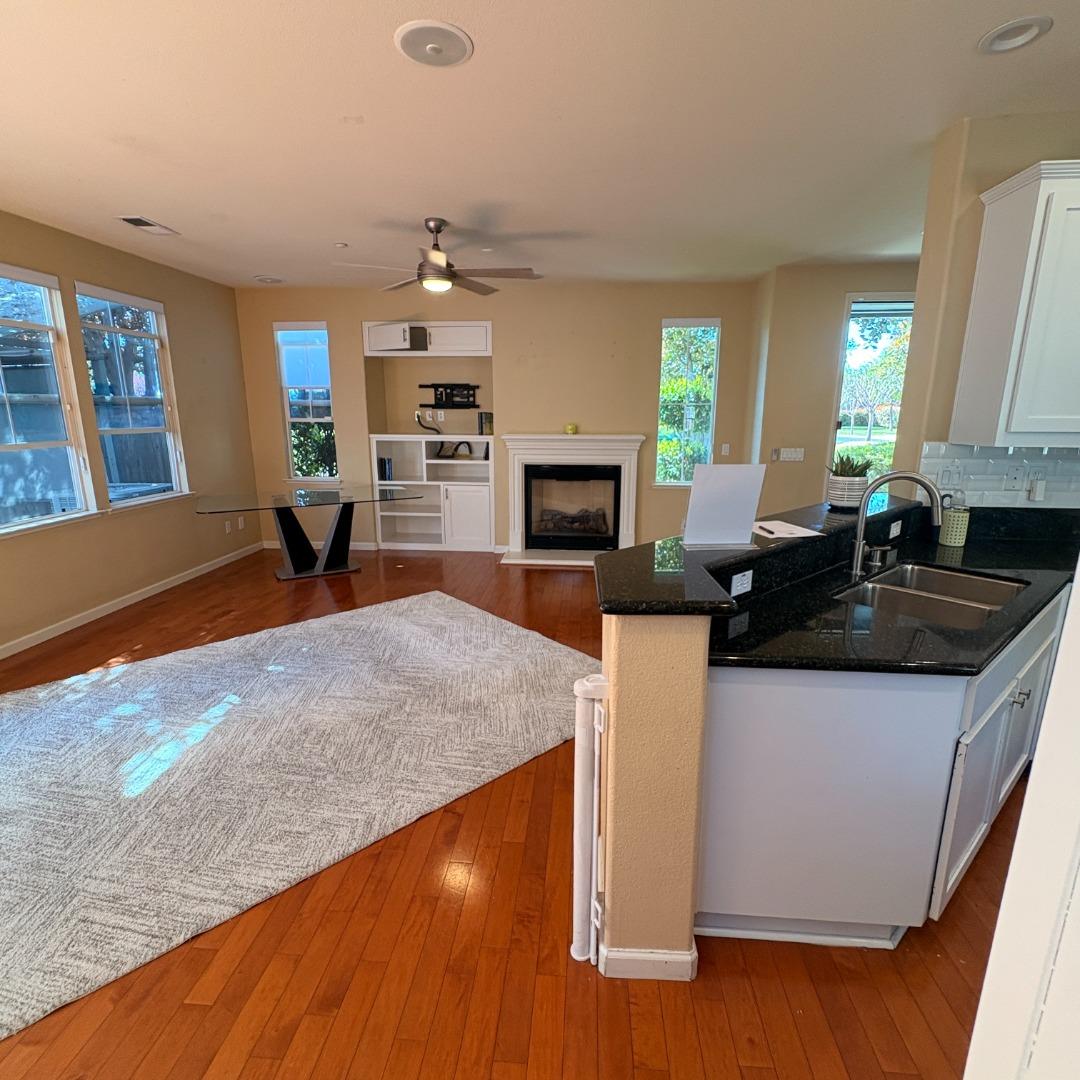 7969 Kipling Circle Gilroy, CA 95020 - Photo 4 of 19 a kitchen with granite countertop a sink and a stove top oven