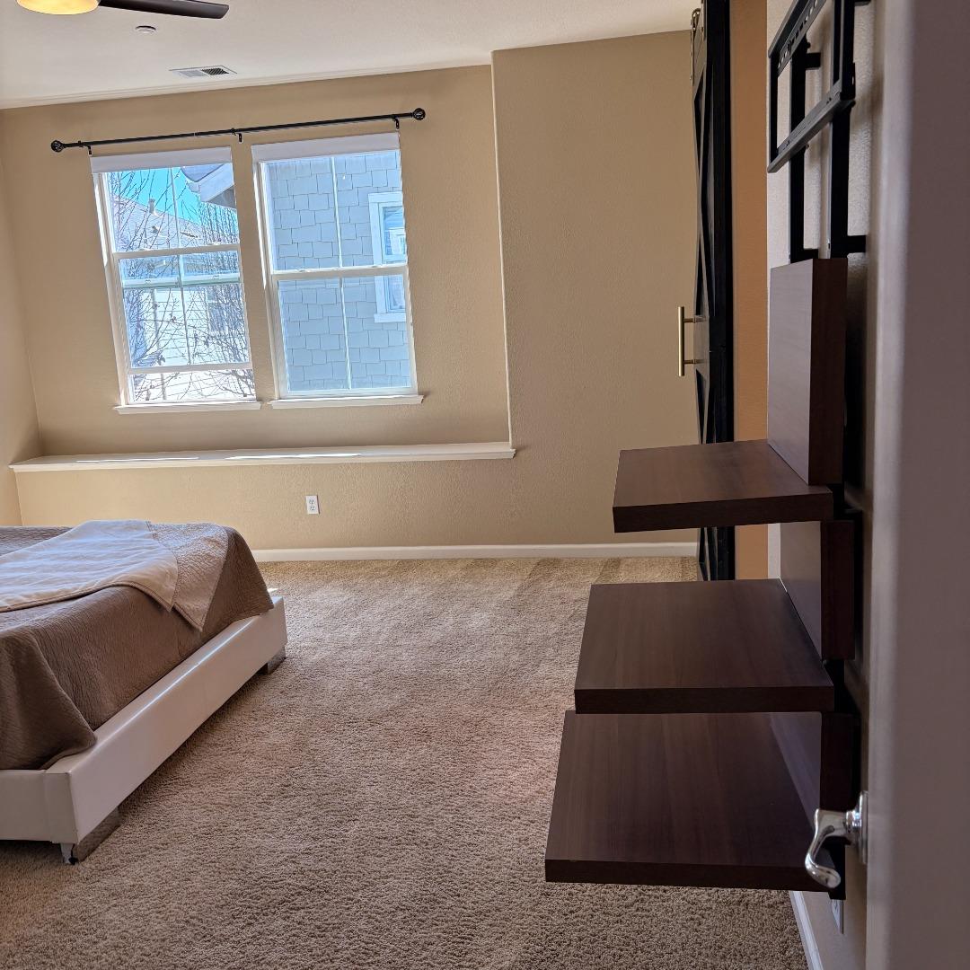 7969 Kipling Circle Gilroy, CA 95020 - Photo 9 of 19 a living room with a bed furniture and next to a window
