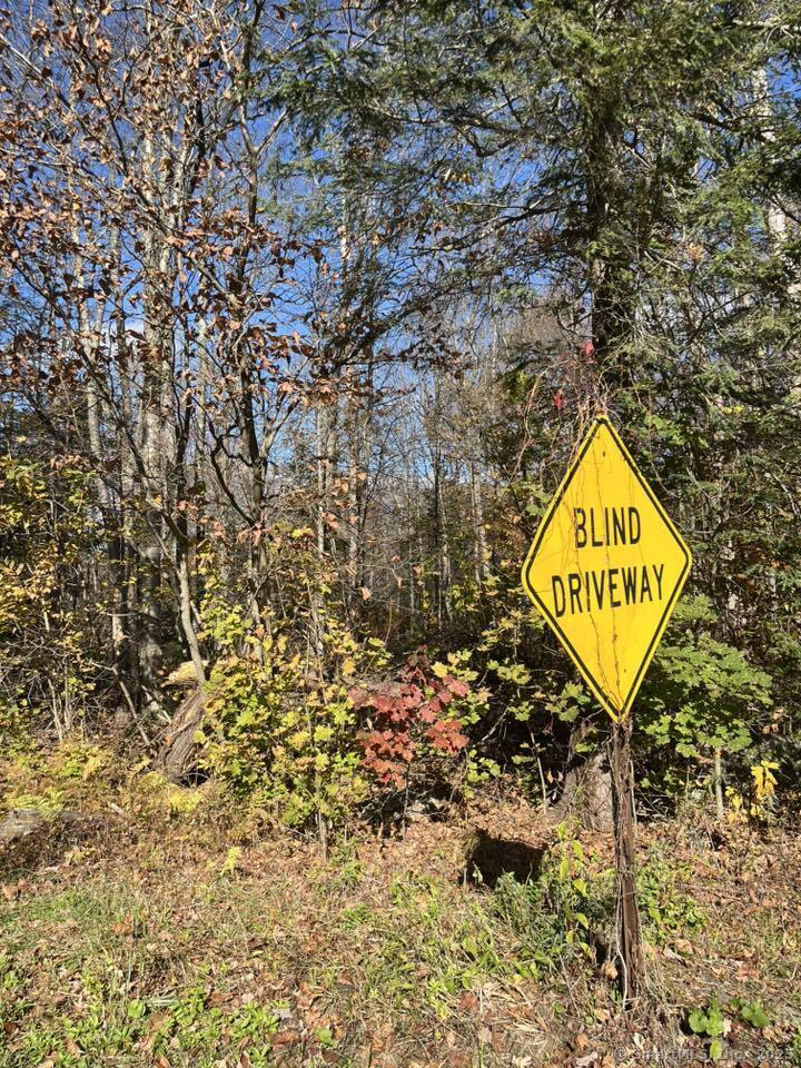 a sign that is sitting on a rock