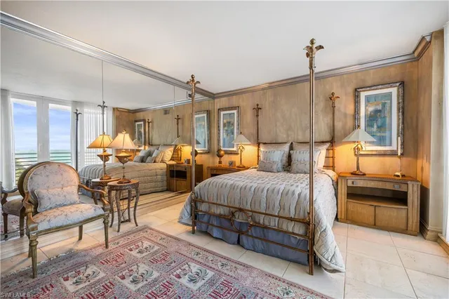 a bathroom with a granite countertop sink a toilet a mirror and shower