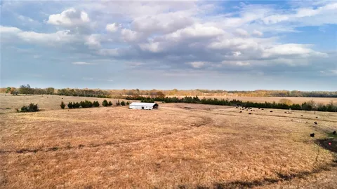 a view of a lake with houses in the back