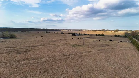 a view of a lake with beach and city view