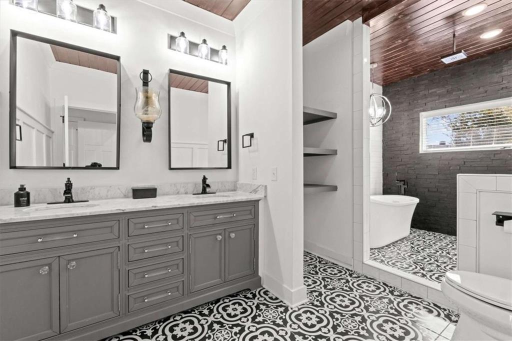 1127 Lakeshore Court Villa Rica, GA 30180 - Photo 27 of 86 a bathroom with a double vanity sink mirror and toilet