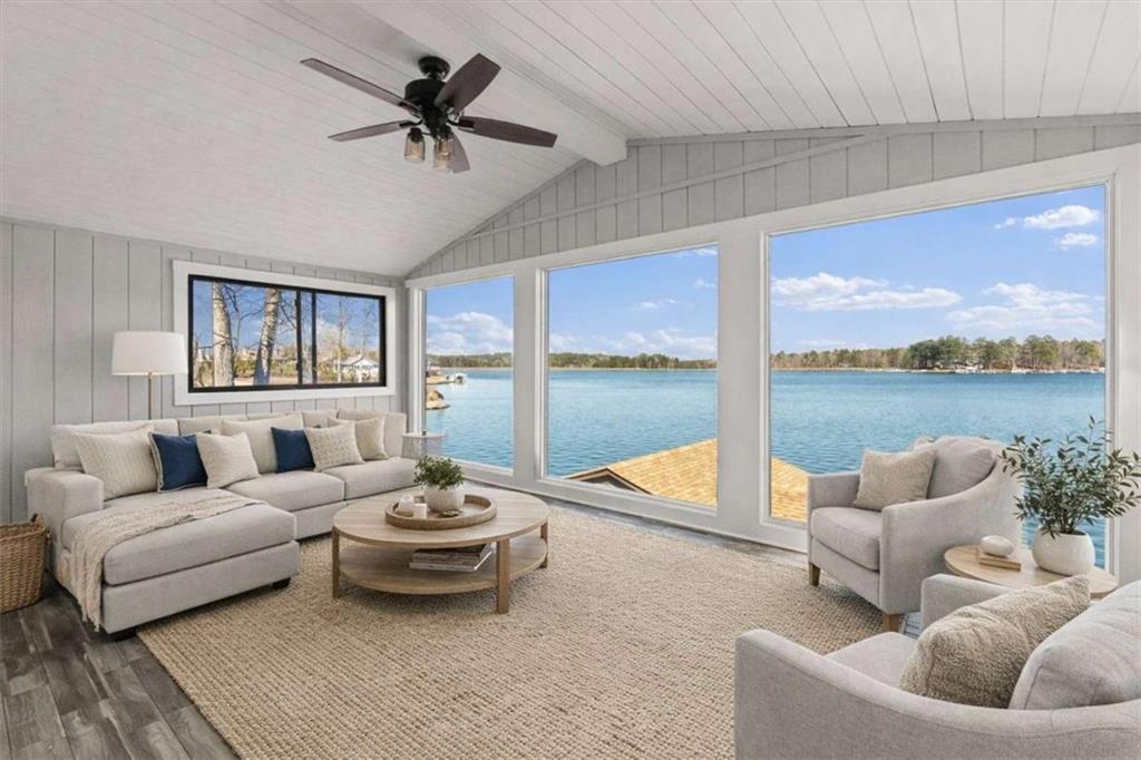 1127 Lakeshore Court Villa Rica, GA 30180 - Photo 32 of 86 a living room with furniture and a floor to ceiling window